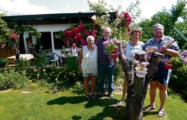 happy-people-stood-in-garden
