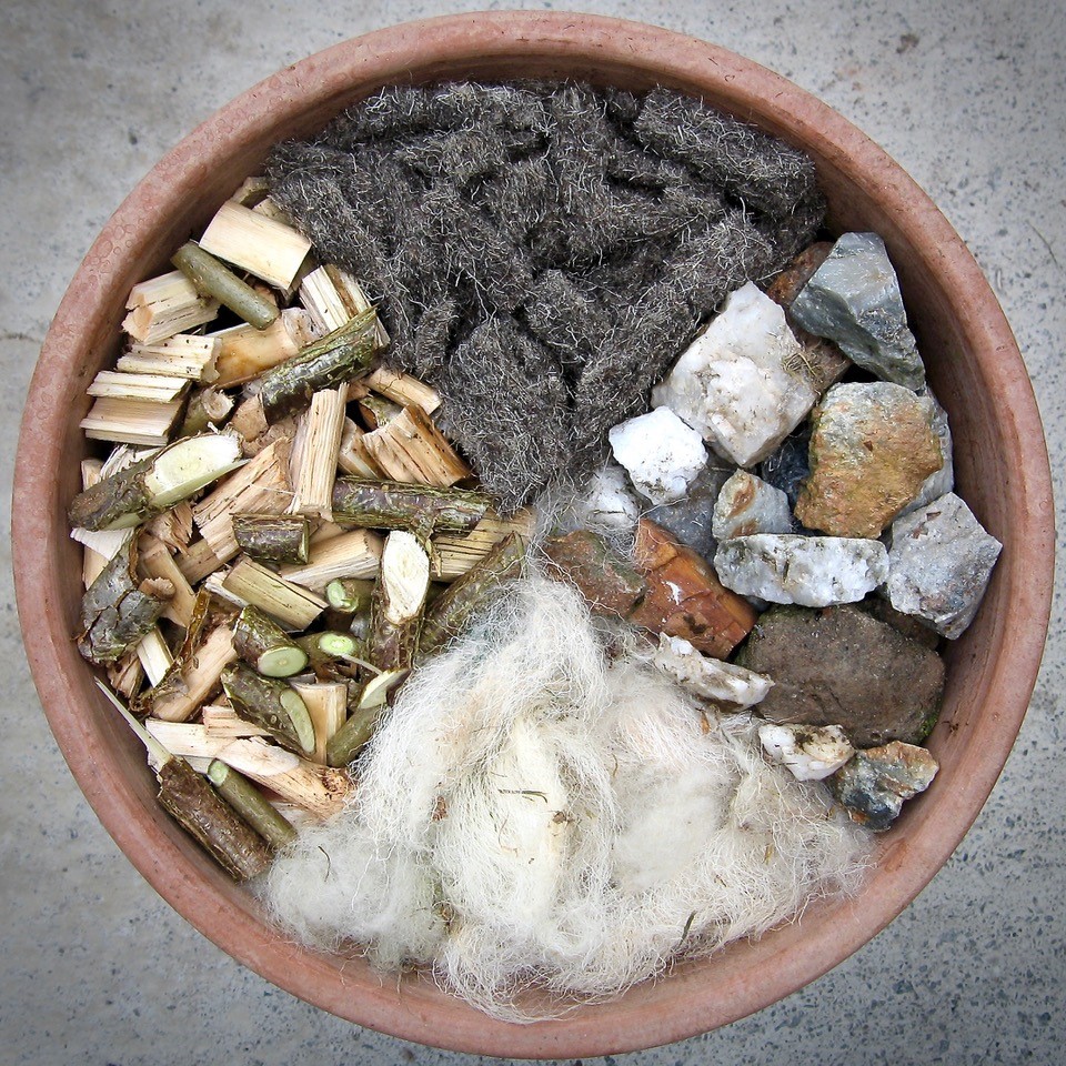 Using stones, shredded prunings and sheep's wool for gardening.